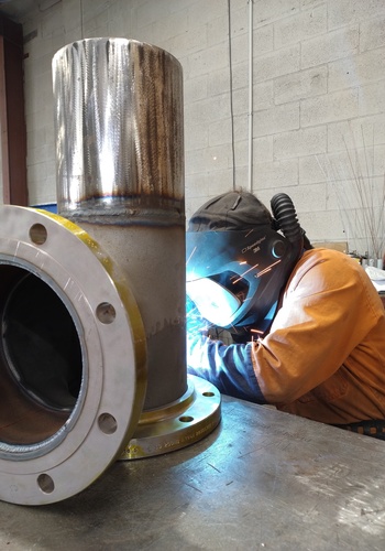 Aluminium fabrication at ORCA Engineering workshop showing a technician working on a custom metal project
